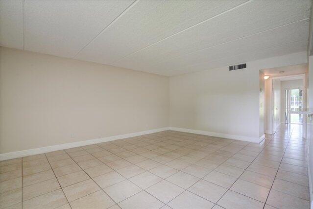 1104 Meadows Circle, Unit 1104 Boynton Beach, FL 33436 - Photo 5 of 27 a view of an empty room and window