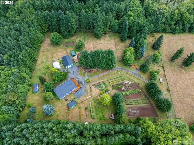 an aerial view of a house with outdoor space and lake view