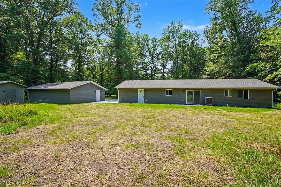 7583 Yale Road Atwater, OH 44201 - Photo 10 of 41 Backyard has so many possibilities. 3.38 acres of land. Updated 10X12 outbuilding provides additional exterior storage space and other possibilities.