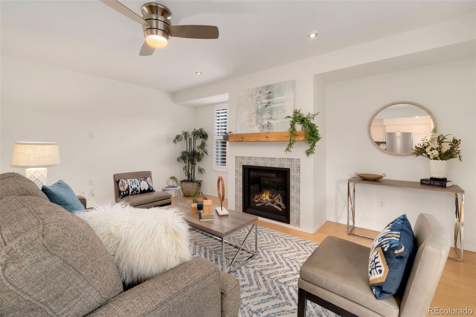 9752 Quay Loop Westminster, CO 80021 - Photo 12 of 27 a living room with furniture and a fireplace