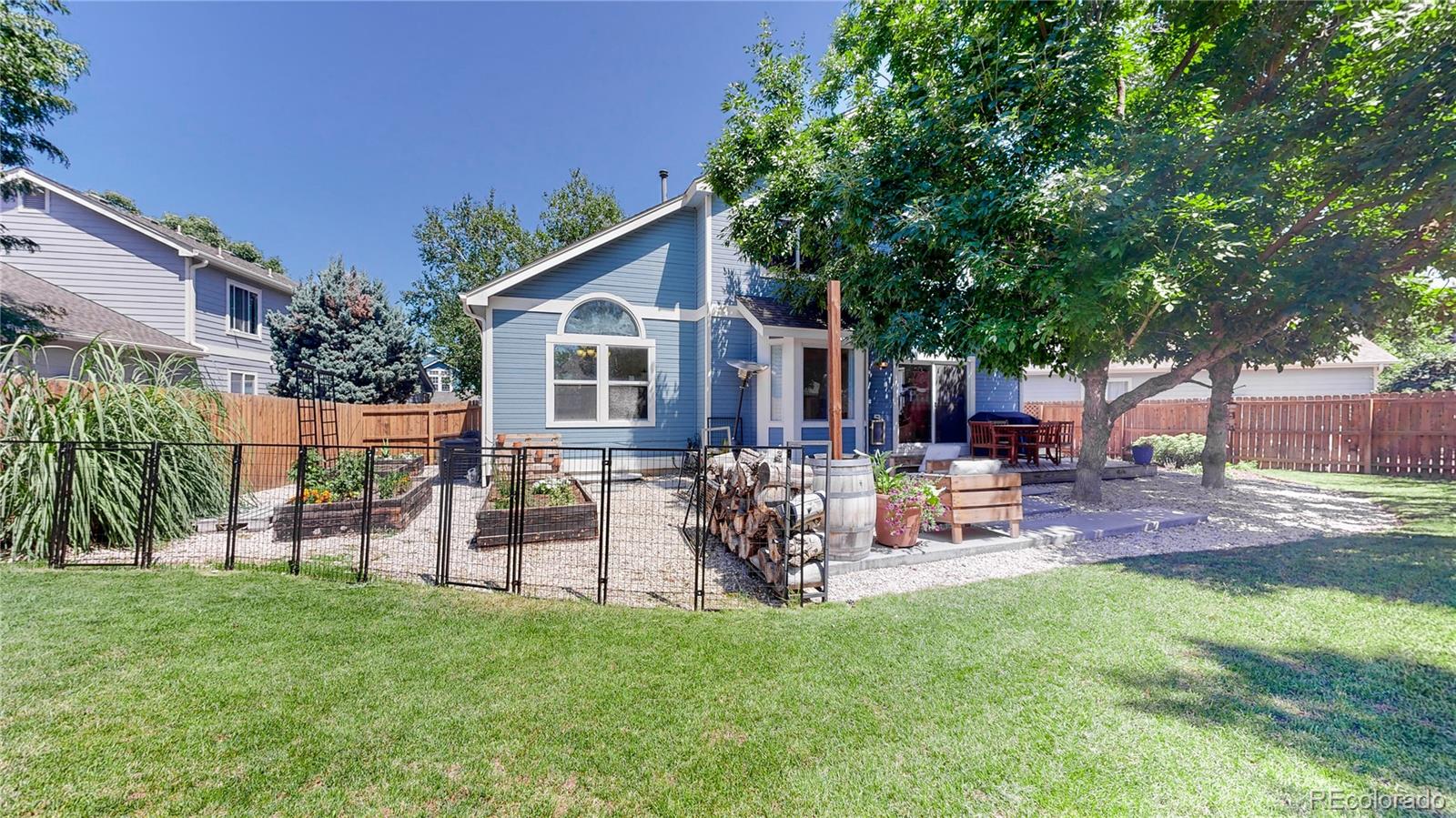 9752 Quay Loop Westminster, CO 80021 - Photo 27 of 27 a view of a house with a yard and sitting area