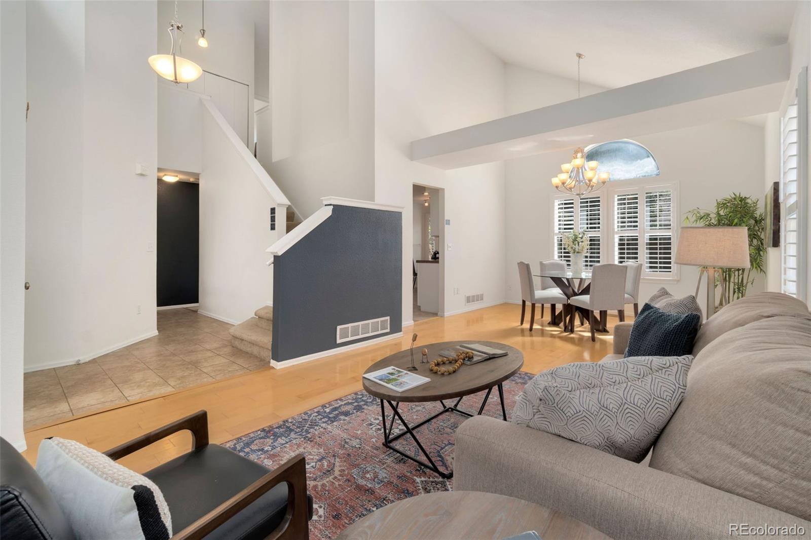 9752 Quay Loop Westminster, CO 80021 - Photo 3 of 27 a living room with furniture and a large window