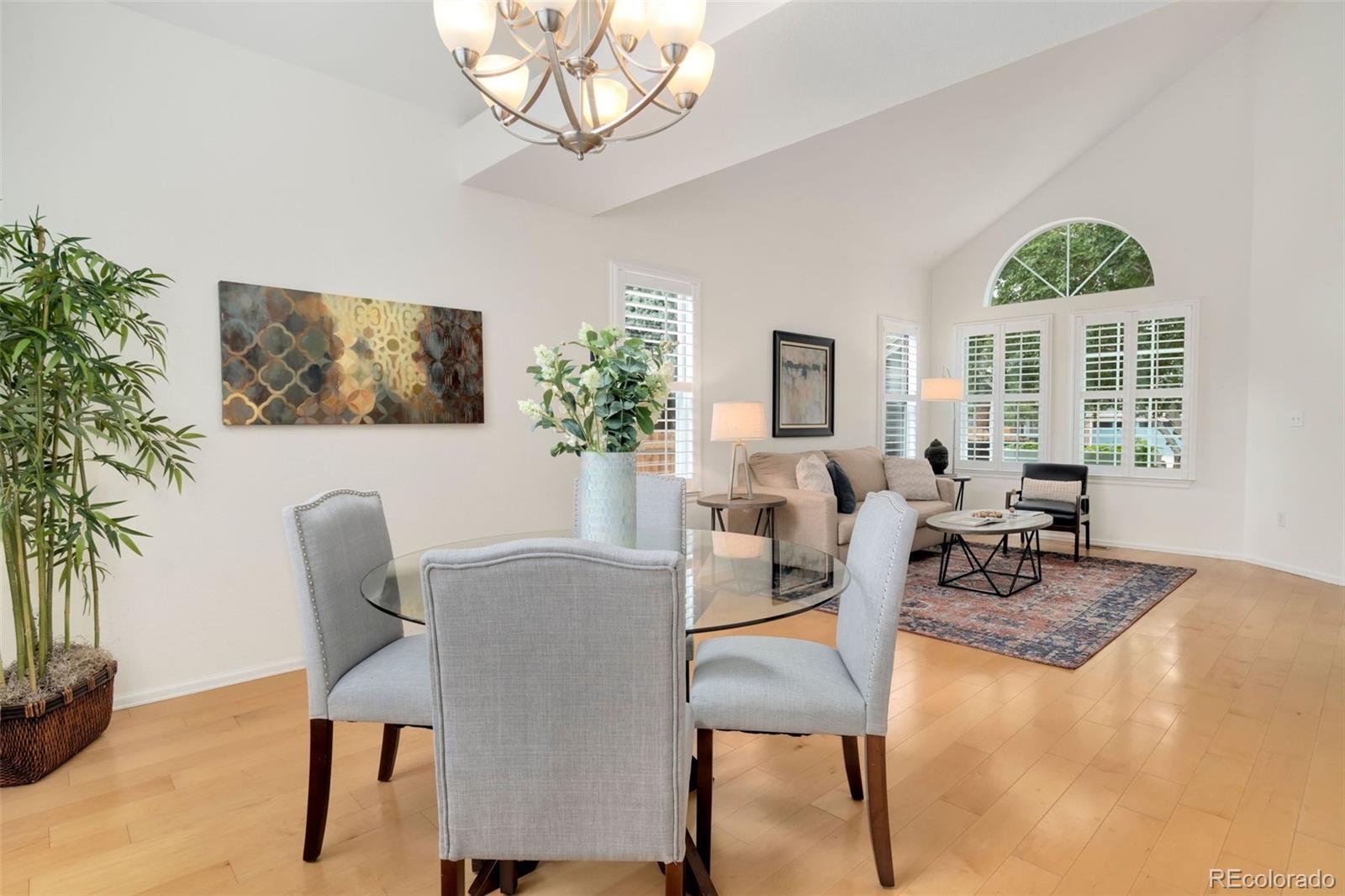9752 Quay Loop Westminster, CO 80021 - Photo 5 of 27 a view of a dining room with furniture window and wooden floor