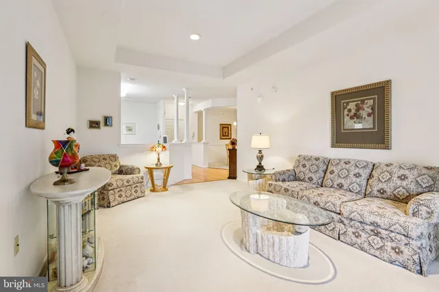 a living room with furniture and a table