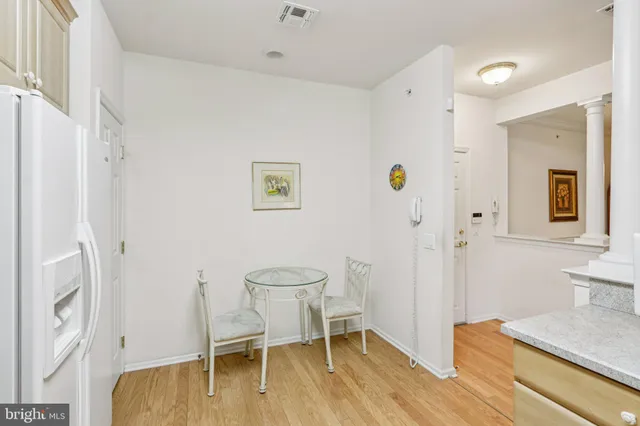 a view of a room with wooden floor and workspace