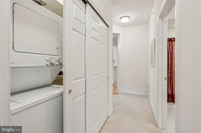 a view of a hallway with a wooden door