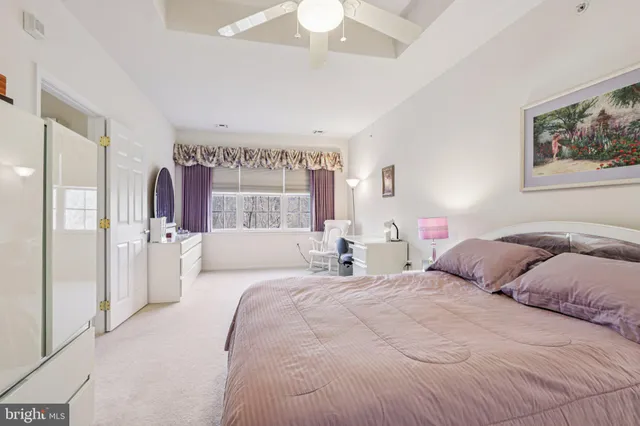a en suite bathroom with a double vanity sink a mirror and a shower