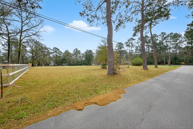 a view of a yard with a tree