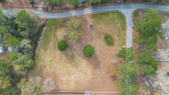 a view of a swimming pool with green space