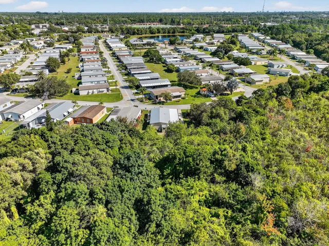 a view of a livingroom with furniture and a window