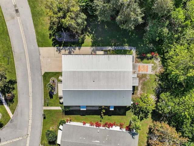 a kitchen with a refrigerator a sink and a stove top oven