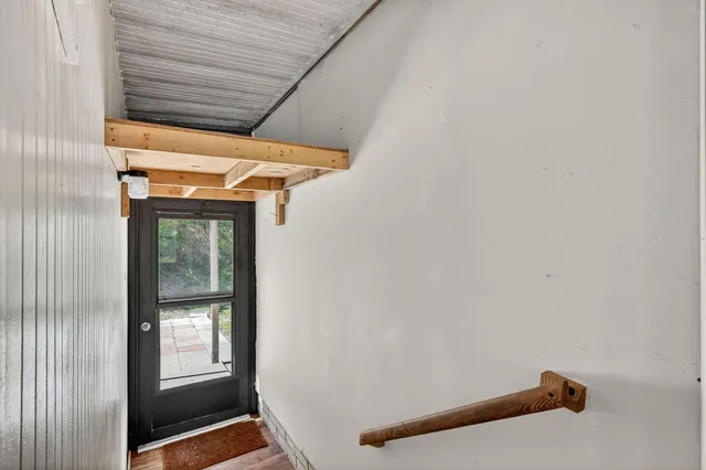 a view of a kitchen with furniture and a window