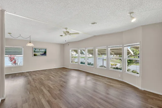 a white toilet sitting next to a shower