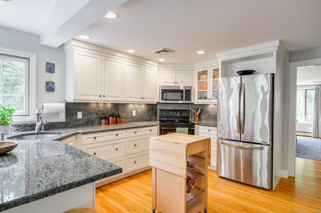 7 Carlton Road Marblehead, MA 01945 - Photo 3 of 42 a kitchen with stainless steel appliances granite countertop a refrigerator a stove a sink and a microwave