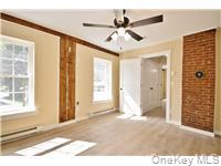 162 Rockland Road Roscoe, NY 12776 - Photo 11 of 36 a view of a livingroom with a ceiling fan and window