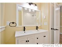 162 Rockland Road Roscoe, NY 12776 - Photo 15 of 36 a bathroom with a sink and a mirror