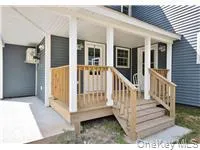 a view of a house with porch and wooden floor