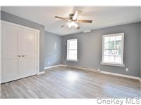 162 Rockland Road Roscoe, NY 12776 - Photo 28 of 36 a view of an empty room with wooden floor and a window