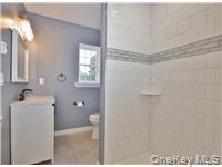 162 Rockland Road Roscoe, NY 12776 - Photo 30 of 36 a bathroom with a sink toilet and shower