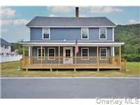 a aerial view of a house with a yard