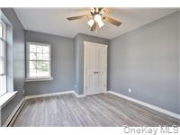 162 Rockland Road Roscoe, NY 12776 - Photo 31 of 36 wooden floor in an empty room with a window