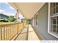 162 Rockland Road Roscoe, NY 12776 - Photo 4 of 36 a view of balcony with wooden floor