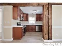 a kitchen with stainless steel appliances granite countertop a refrigerator and a stove