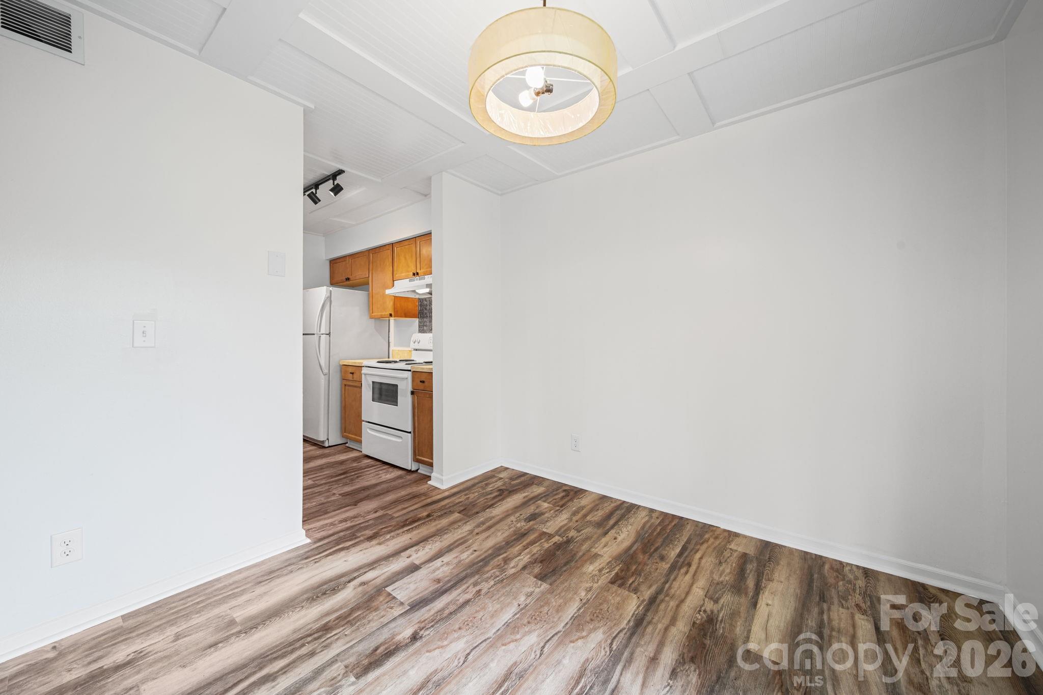 11023 Harrowfield Road Charlotte, NC 28226 - Photo 10 of 32 a view of a room with wooden floor