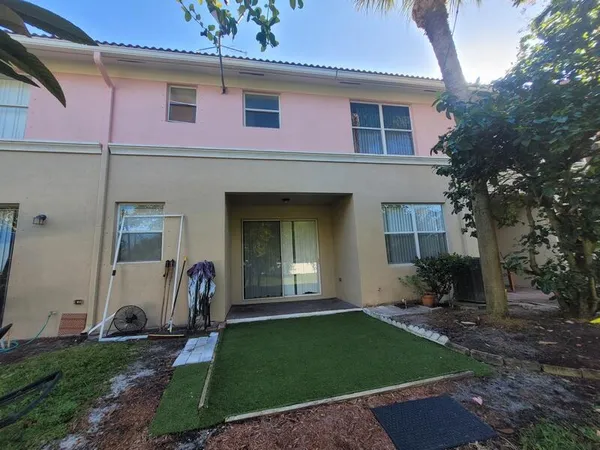a front view of a house with seating space