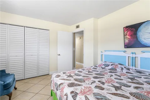 a bedroom with a bed and a cabinets