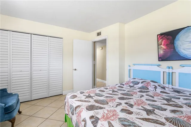 a bedroom with a bed and a cabinets