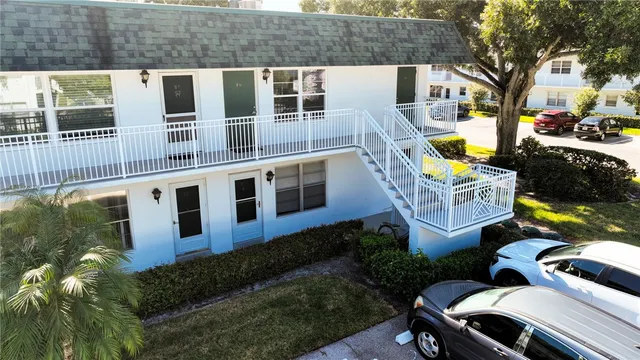 a aerial view of a house with swimming pool and sitting area