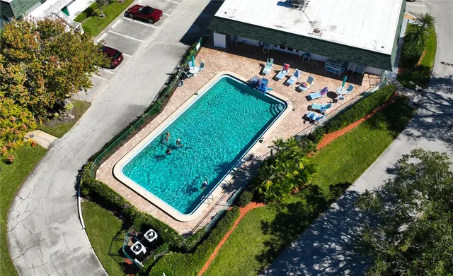 a view of a swimming pool with a lounge chair