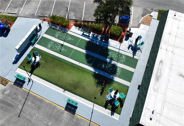a view of a swimming pool with a patio and a garden