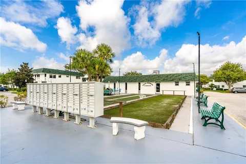 an aerial view of a residential houses with outdoor space and swimming pool