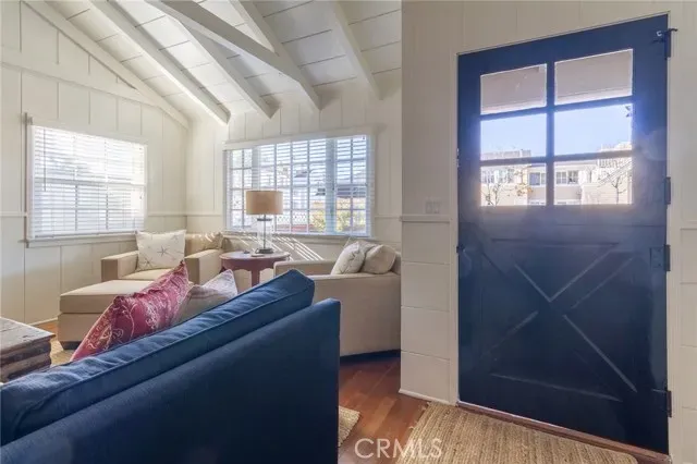a living room with furniture and windows