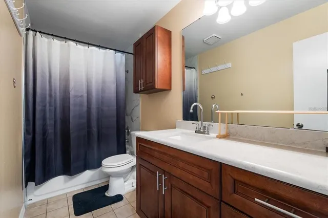 a bedroom with bed and a window