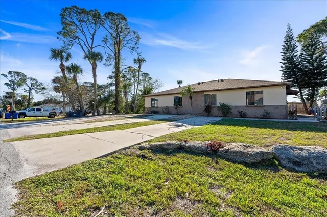 an aerial view of residential houses with city and lake view