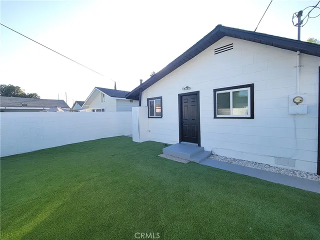 a backyard of a house with lots of green space