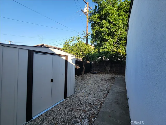 a view of a pathway with a plants