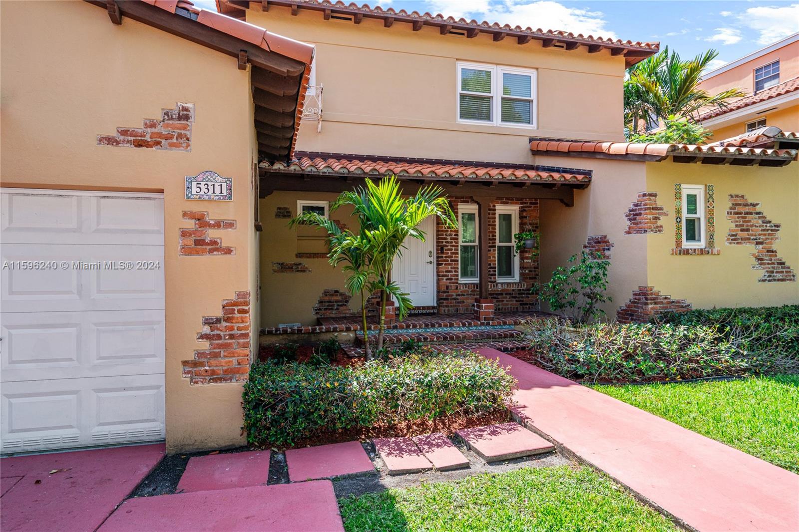 5311 Alton Road Miami Beach, FL 33140 - Photo 11 of 51 a front view of a house with garden