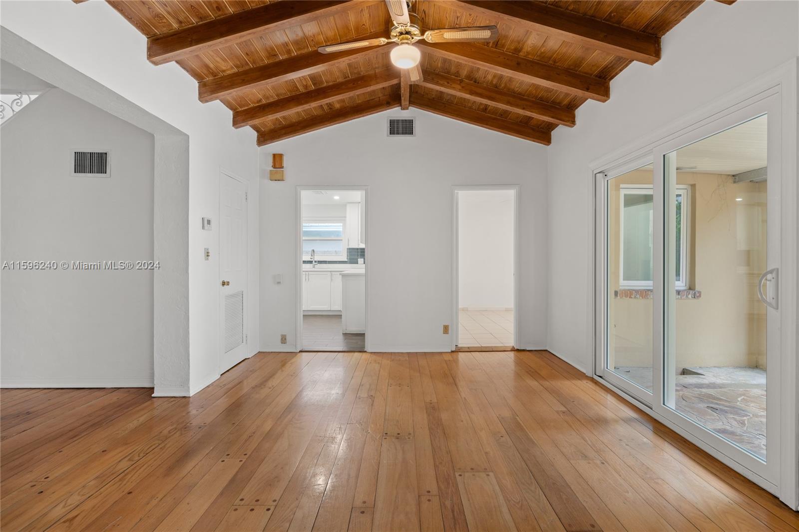 5311 Alton Road Miami Beach, FL 33140 - Photo 14 of 51 a view of a hallway with wooden floor
