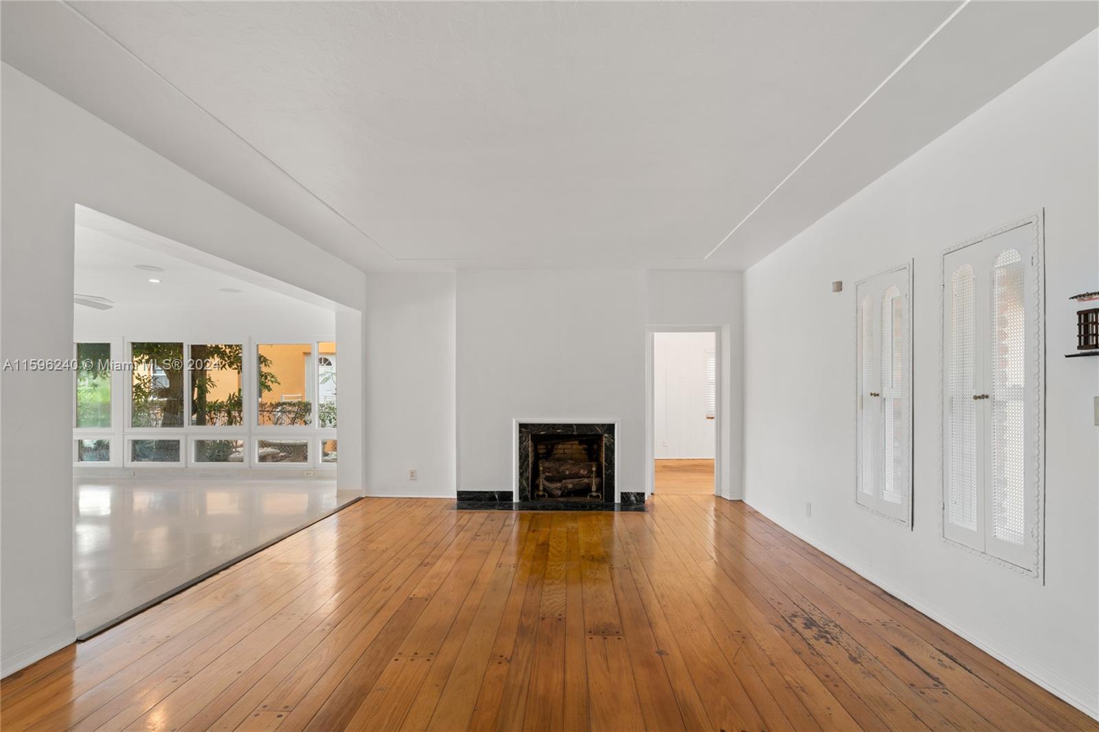 5311 Alton Road Miami Beach, FL 33140 - Photo 16 of 51 wooden floor in an empty room with a window