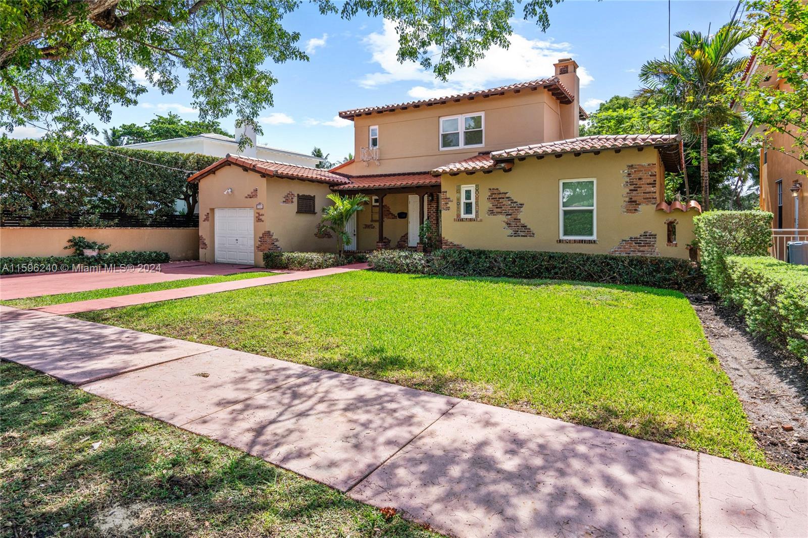 5311 Alton Road Miami Beach, FL 33140 - Photo 2 of 51 a front view of a house with a yard