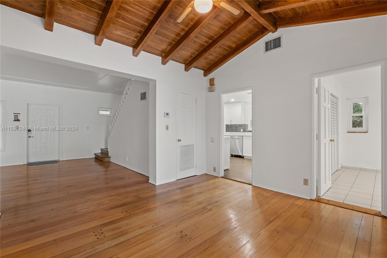 5311 Alton Road Miami Beach, FL 33140 - Photo 30 of 51 a view of empty room with wooden floor