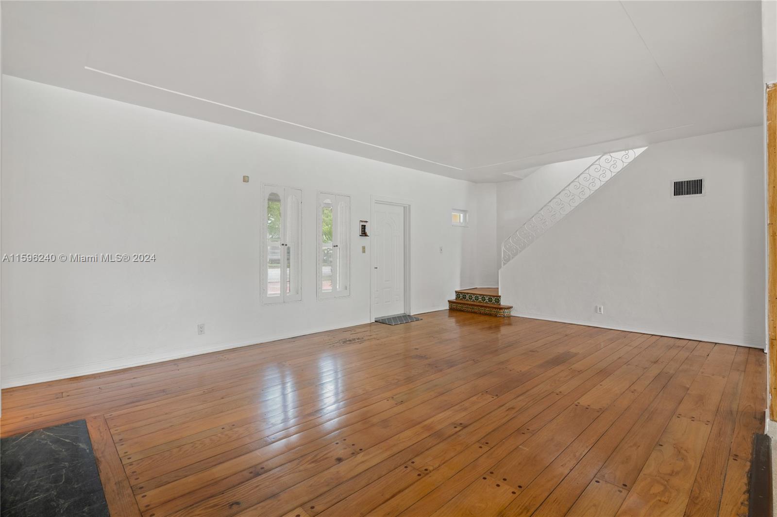 5311 Alton Road Miami Beach, FL 33140 - Photo 32 of 51 a view of a livingroom with wooden floor
