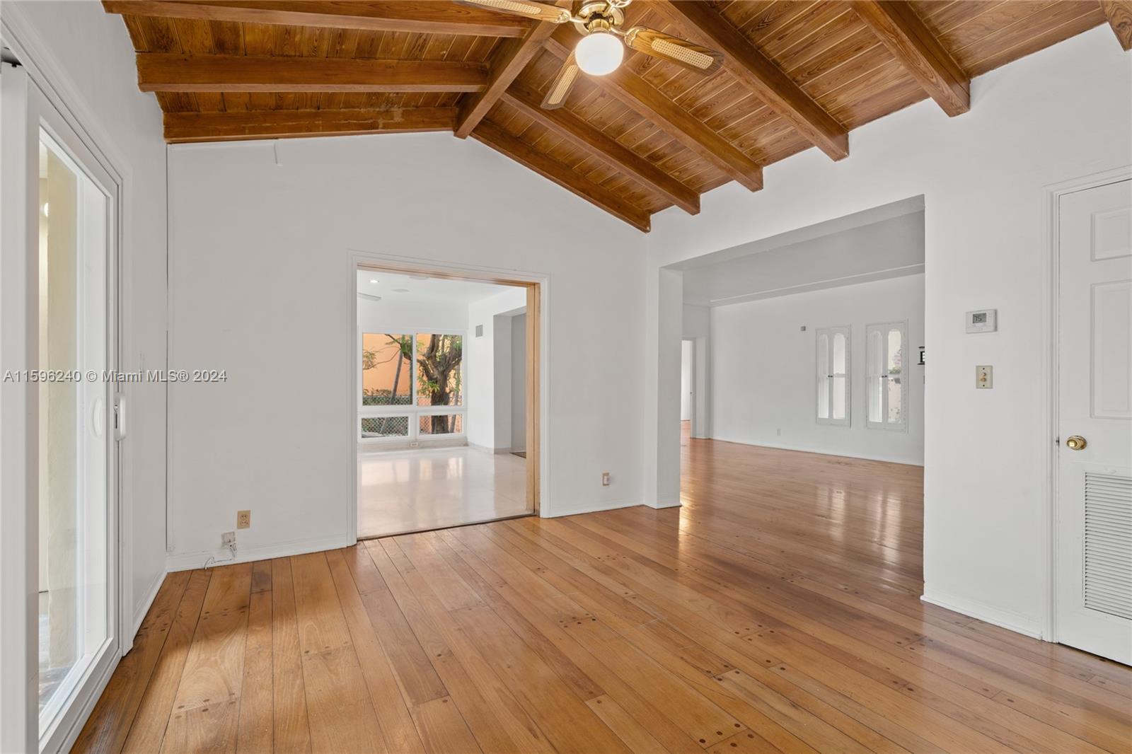 5311 Alton Road Miami Beach, FL 33140 - Photo 38 of 51 a view of empty room with wooden floor