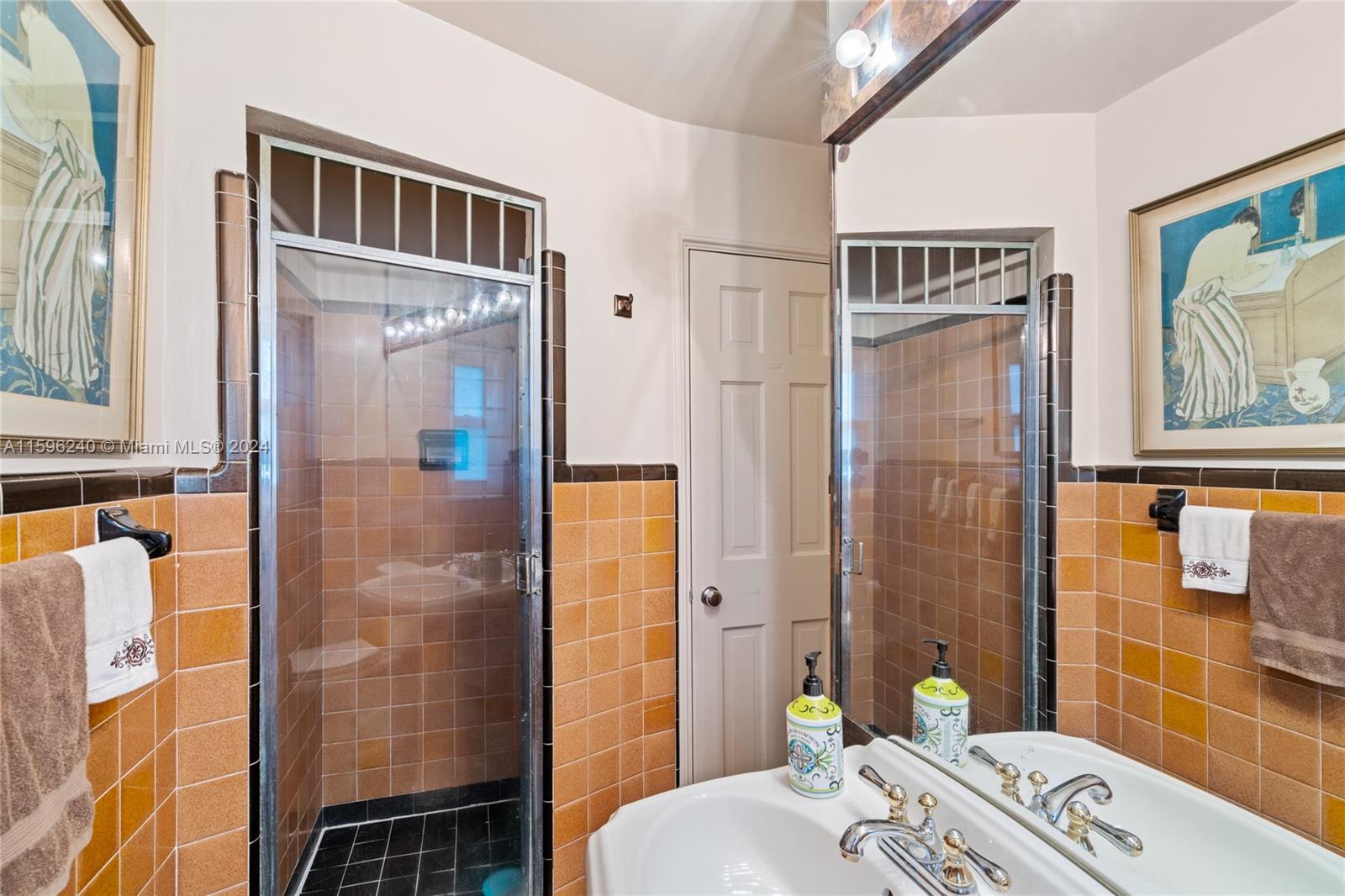 5311 Alton Road Miami Beach, FL 33140 - Photo 42 of 51 a bathroom with a sink a toilet and shower