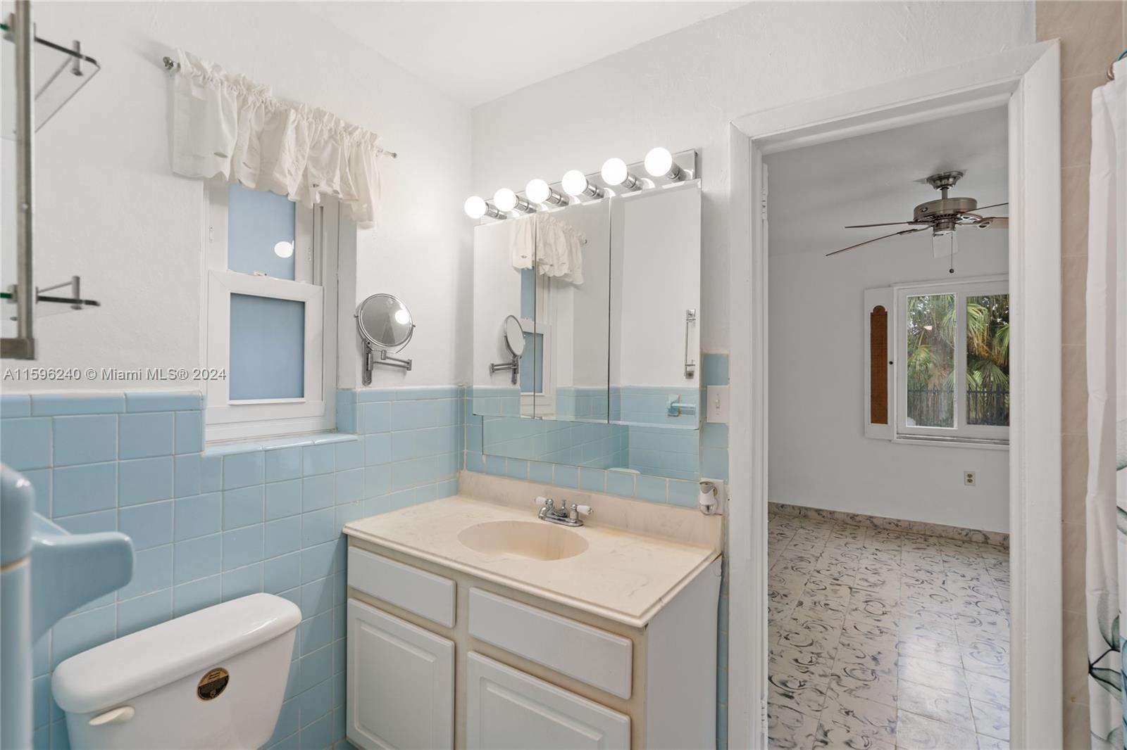 5311 Alton Road Miami Beach, FL 33140 - Photo 43 of 51 a bathroom with a sink a toilet and shower