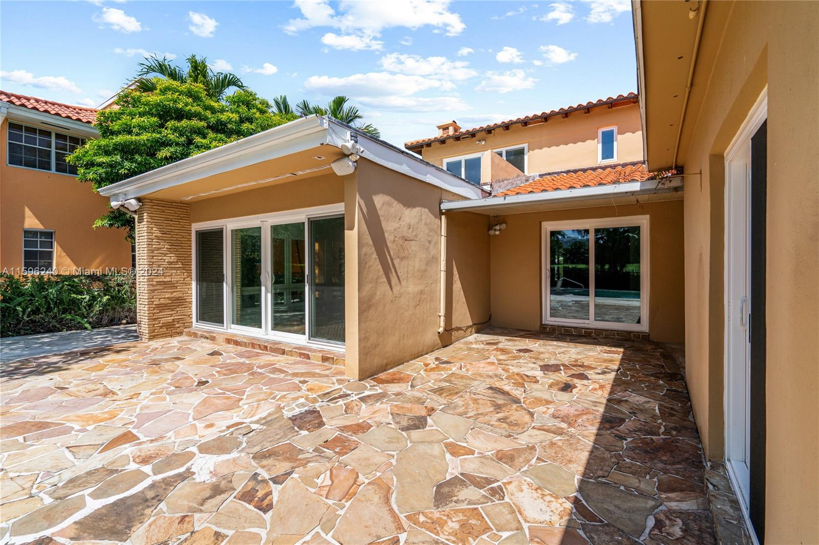 5311 Alton Road Miami Beach, FL 33140 - Photo 48 of 51 a front view of a house with a yard